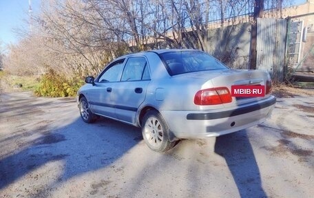 Mitsubishi Carisma I, 2003 год, 127 000 рублей, 24 фотография