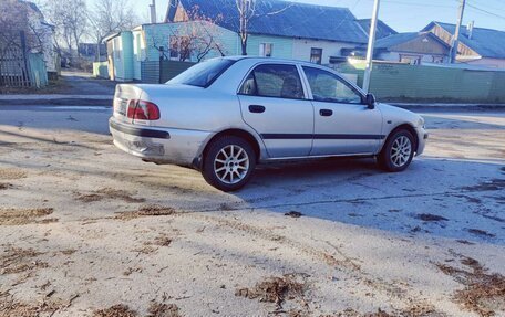 Mitsubishi Carisma I, 2003 год, 127 000 рублей, 34 фотография