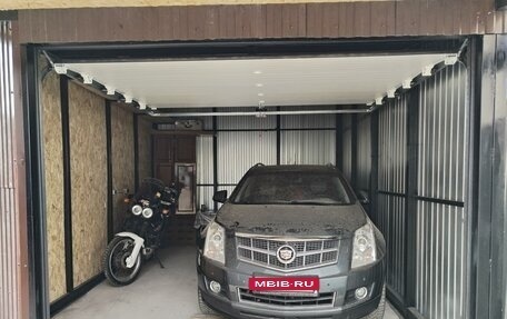 Cadillac SRX II рестайлинг, 2011 год, 400 000 рублей, 3 фотография