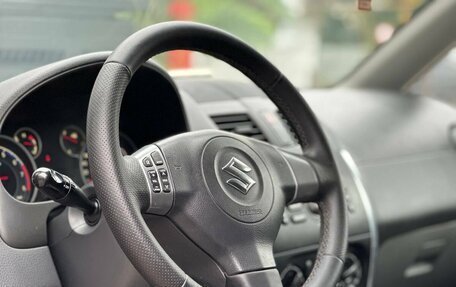Suzuki SX4 II рестайлинг, 2010 год, 599 000 рублей, 24 фотография