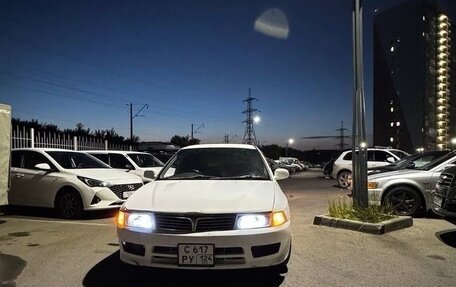 Mitsubishi Mirage VI рестайлинг, 1998 год, 210 000 рублей, 24 фотография