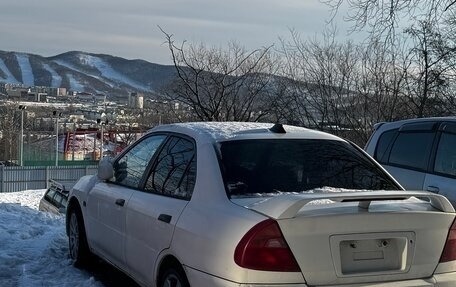 Mitsubishi Mirage VI рестайлинг, 1999 год, 150 000 рублей, 1 фотография