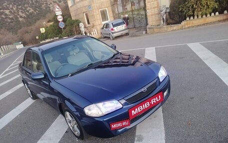 Mazda Familia, 2000 год, 305 000 рублей, 14 фотография