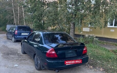 Mitsubishi Mirage VI рестайлинг, 2000 год, 300 000 рублей, 5 фотография