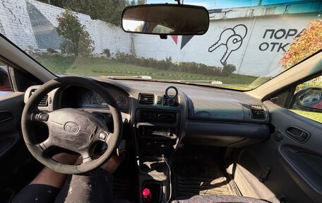Mazda 323, 1998 год, 150 000 рублей, 9 фотография